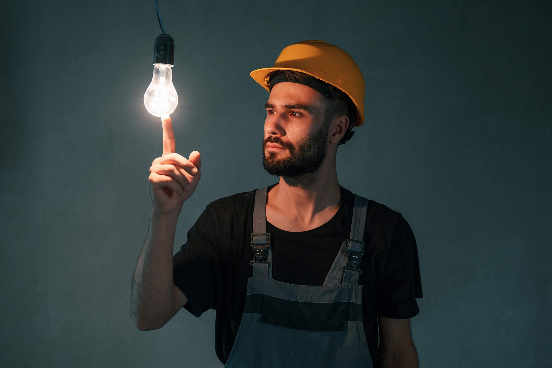 light-bulb-in-the-dark-room-the-man-is-making-rep-2023-11-27... light-bulb-in-the-dark-room-the-man-is-making-rep-2023-11-27-05-11-14-VTQDHMQ.jpg